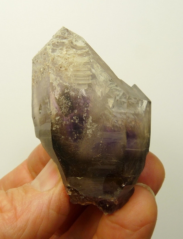 Amethyst / smoky quartz crystal with large, deep windows