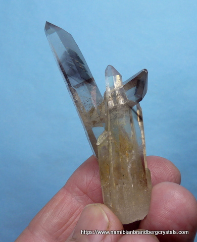 Quartz crystal group with smoky / amethyst phantoms