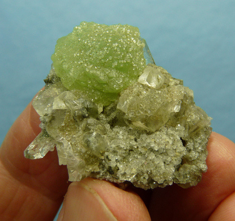 Prehnite and calcite on matrix, covered by analcime crystals