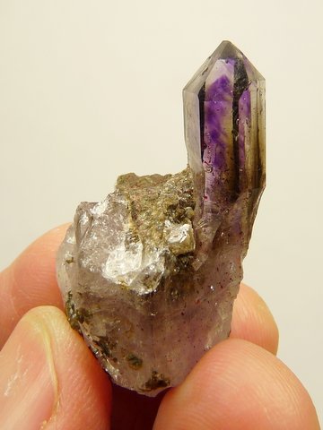 Smoky / amethyst quartz crystal on crystal matrix