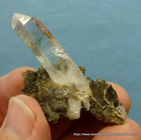 Quartz crystal on calcite and quartz matrix