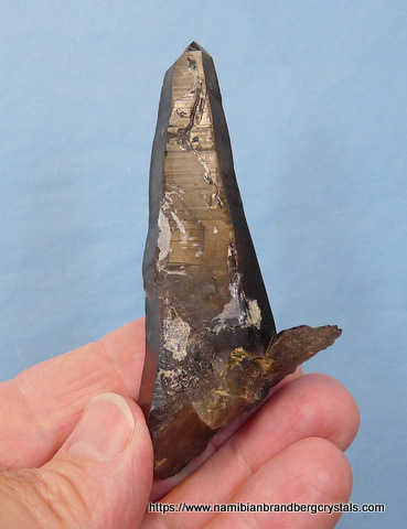 Smoky quartz crystal with bits of hyalite opal