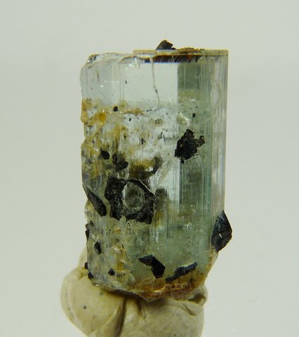 Aquamarine crystal with bits of schorl