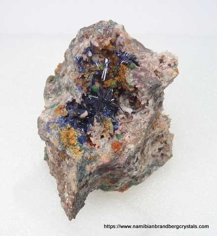 Gemmy azurite crytals and malachite balls fills a cavity