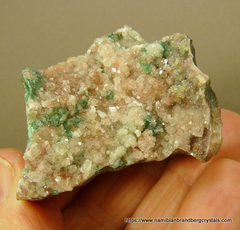 Calcite with shades of pink and green, on matrix