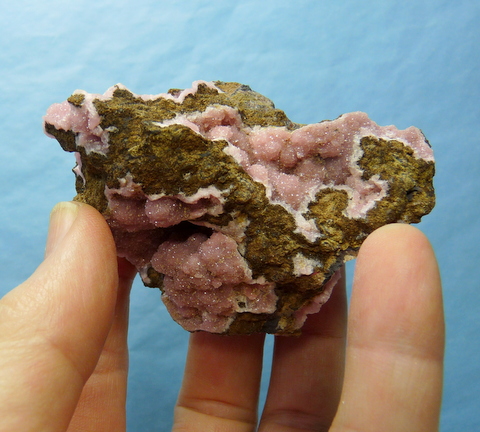 Minute rhodochrosite crystals in geodes and semi-geodes, on matrix