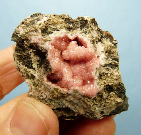Gemmy, sparkling rhodochrosite crystals on rhodochrosite and manganite matrix