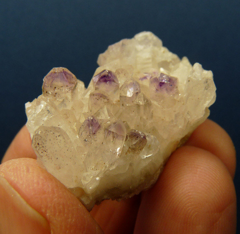 Quartz crystal group with amethyst phantoms