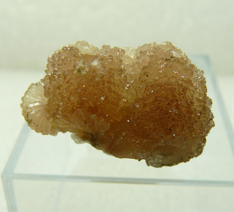 Aggregates of olmiite crystals on calcite crystals