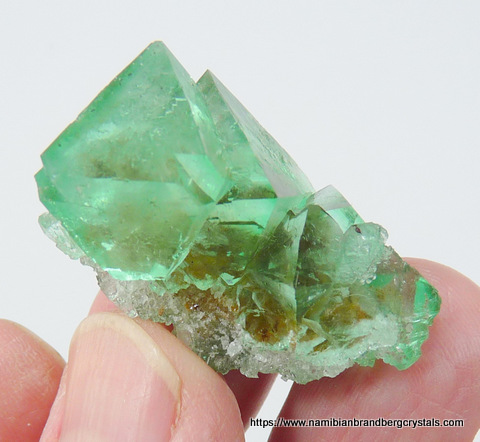 Vivid green, gemmy fluorite crystals with inclusions