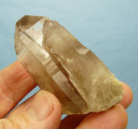 Light smoky quartz crystal with attached crystal