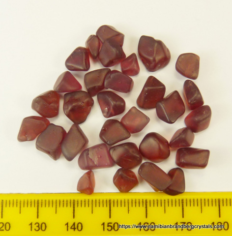 Tumbled red garnets from the pyrope group