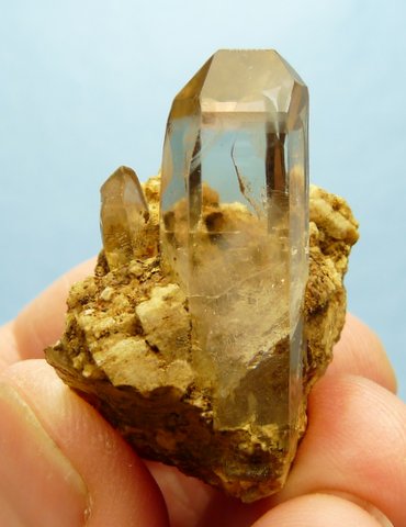 Light smoky quartz crystal on matrix