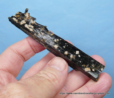 Aegirine crystal with small aegerine, quartz and feldspar crystals