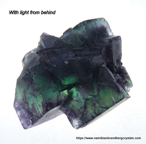 Dark green fluorite crystal cluster with bits of purple