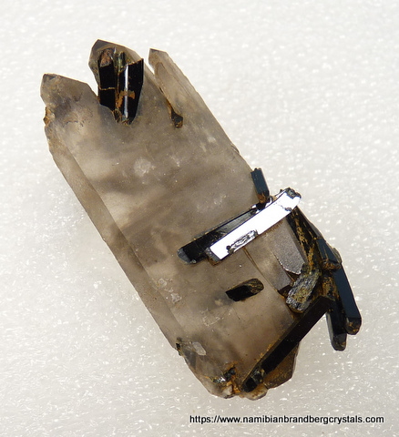 Flat quartz crystal with aegerine crystals inside and on top